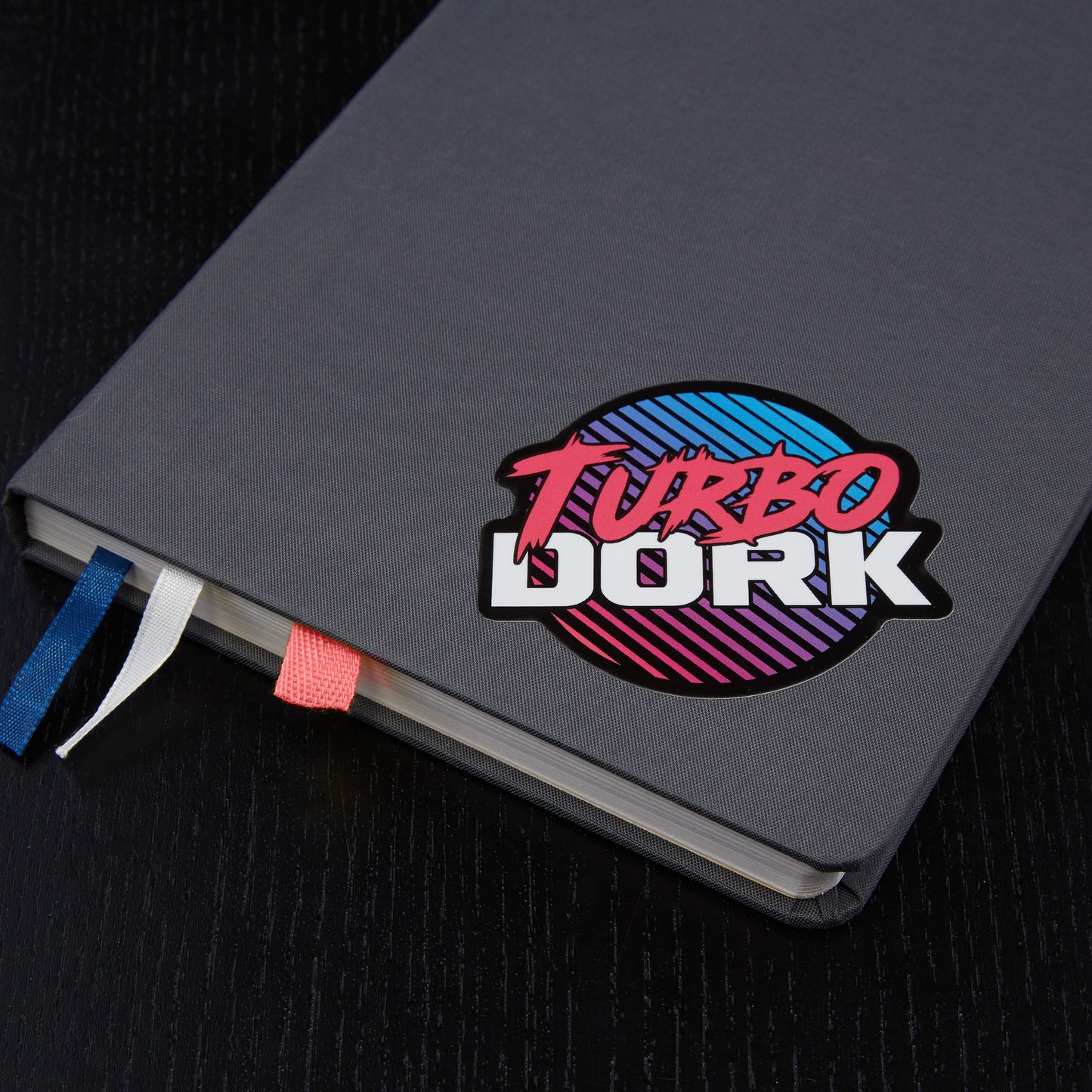 Turbo Dork logo sticker on book